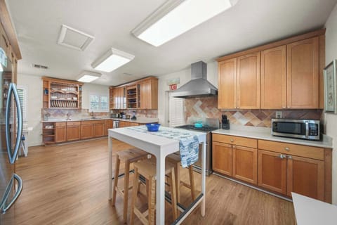 Spacious and well-equipped kitchen perfect for family gatherings and culinary adventures.