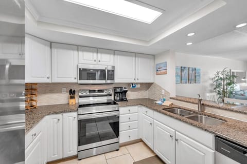 Clean, modern kitchen layout w/ stainless appliances and bright finishes for easy meal prep.