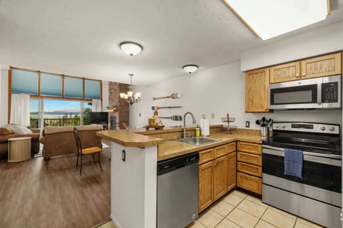 Alternate view of the kitchen with easy access to dining and living areas – perfect for hosting.