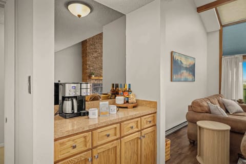 Coffee bar and storage area, conveniently placed near the living room for your morning routine or evening unwind.