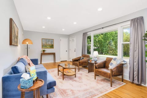 Enjoy conversation in the cozy, light filled living room