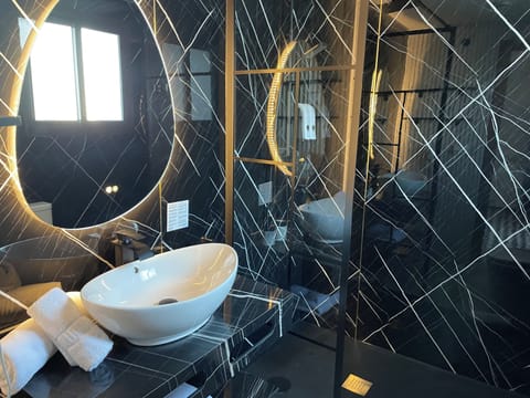 Shower, eco-friendly toiletries, hair dryer, towels