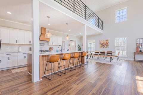 Dine in style with bar seating for 4 and a spacious dining table for 10. Whether it’s breakfast at the island or a group dinner, this setup makes it easy to gather, eat, and enjoy!