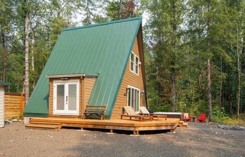 Your cozy A-frame escape awaits! Relax on the deck or soak in the hot tub surrounded by nature. Book your unique getaway now!