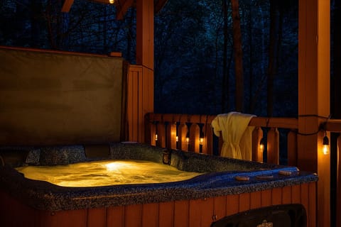 Relax in the serenity of the private back deck hot tub under the stars.