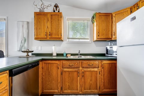 Cook with a view of the calm, sunlit lake