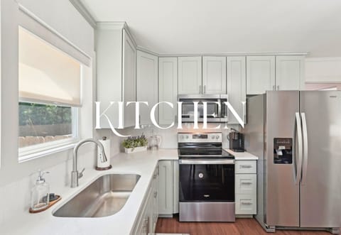 The kitchen is a total showstopper! Fresh cabinetry, sleek counters, and a window over the sink for natural light.