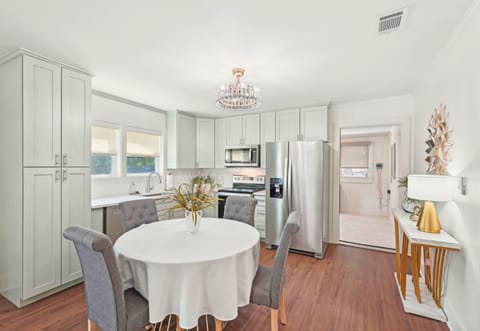 A bright and breezy dining space that flows right into the kitchen—perfect for casual meals or dinner parties.