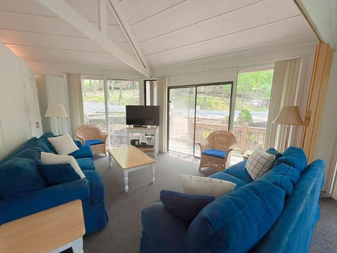 Gather with family or friends in the inviting living area of this charming treetop retreat.