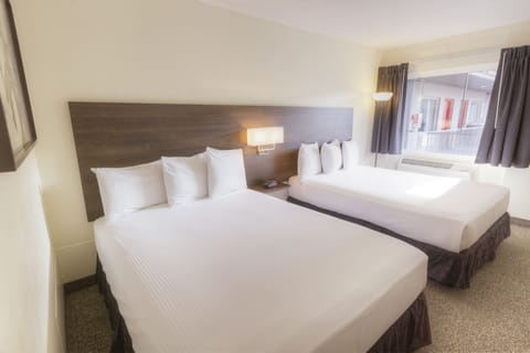 Premium bedding, pillowtop beds, desk, laptop workspace