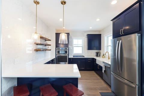 Beautiful quartz counters with extra seating at the bar