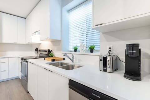 Enjoy morning coffee or prepare delicious meals in this stylish kitchen.