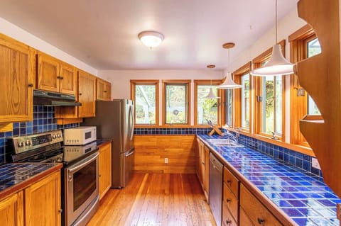 Prepare delicious dishes in this sunny, well-appointed kitchen with ample space for culinary creativity.