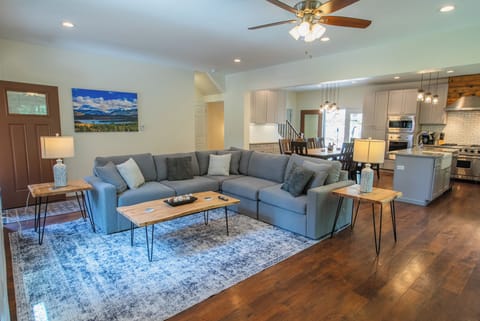 primary living area with primary kitchen and exit to the deck area