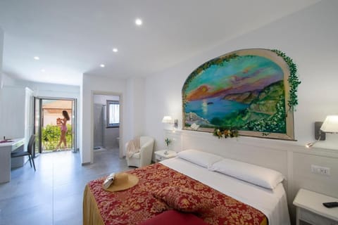 Family Quadruple Room, Balcony, Courtyard View | In-room safe, desk, laptop workspace, blackout drapes