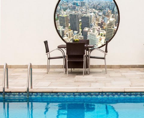 Outdoor pool, open 8:00 AM to 10:00 PM, sun loungers