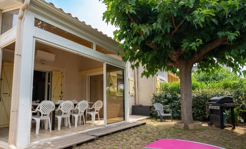 Outdoor area sheltered from view with large veranda and gas barbecue 