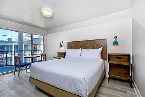 Wake refreshed in a sunlit room with balcony views.