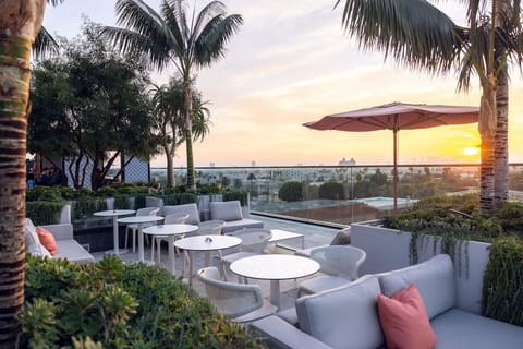 Soak up golden-hour rooftop serenity with cocktails and skyline views.