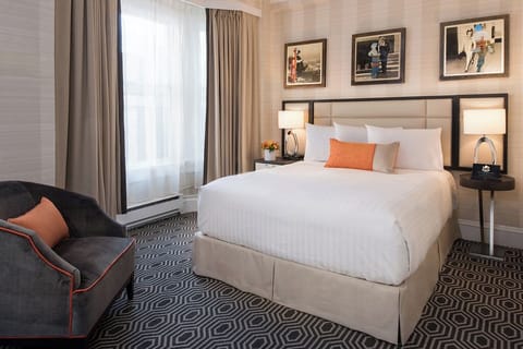 Stretch out in a spotless, inviting bed framed by calming design.