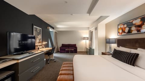 Lounge comfortably with a sofa area just steps from bed.