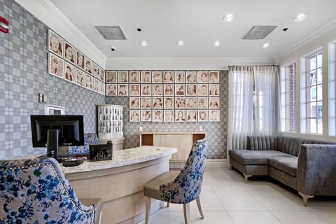 Check in smoothly at the stylish desk with cozy seating.