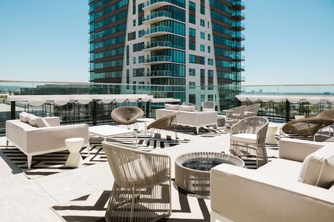 Stretch out on designer loungers with open-sky rooftop energy.