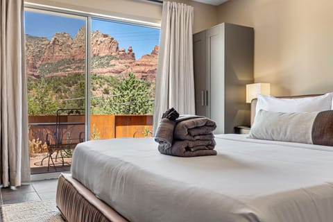 King bed room, Patio with awe-inspiring views of Steamboat Rock and Wilson Mountain, patio access.