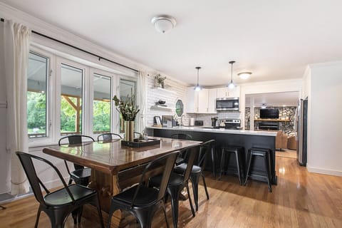Dining area with seating for 8 + bar seating for 6 more. The dining table also has a removable leaf to extend the size for larger groups.