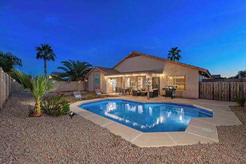 Private yard with a heated swimming pool