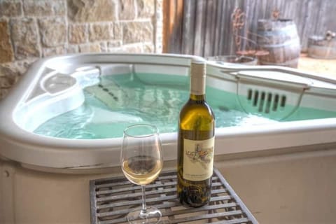 Jacuzzi Retreat: Unwind in style with a bubbling hot tub and a glass of local wine!