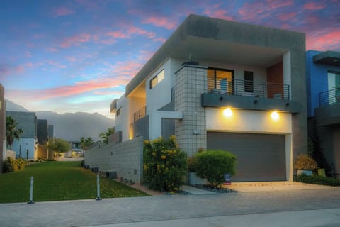 Twilight exterior with mountain backdrop and contemporary architecture