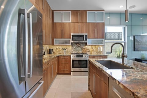 Chef's kitchen with stainless appliances and granite counters