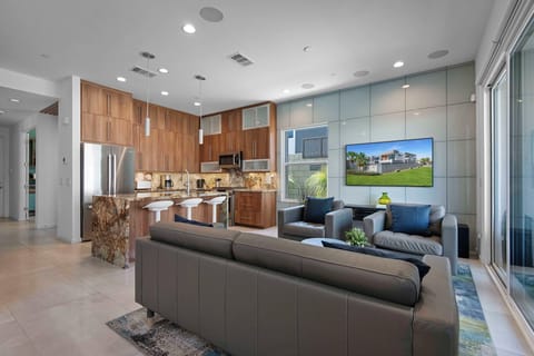 Modern kitchen and living space with large island seating