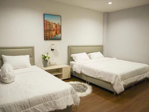 Standard Triple Room with Shared Bathroom | Premium bedding, laptop workspace, blackout drapes