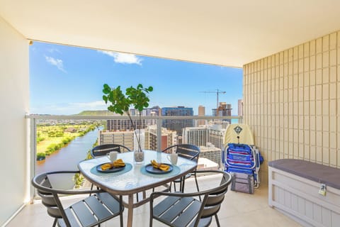 Relax on the balcony with stunning views of the Ala Wai Canal