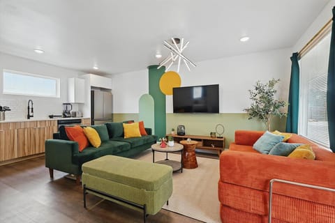 With this living room’s stylish decor and inviting atmosphere, this space is the perfect place to unwind and relax with your companions as you settle into the plush seating.