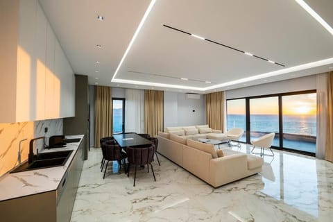 Deluxe Penthouse, Sea View | Living area | TV