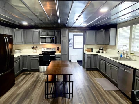 Full kitchen with all necessary utensil and cookware 