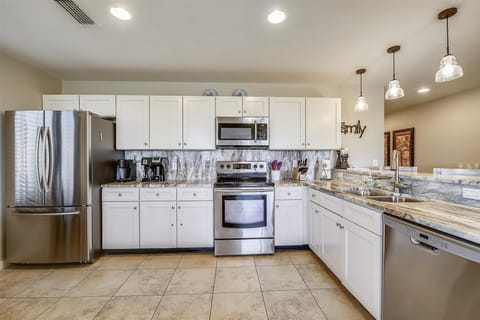 Kitchen is fully stocked and has stainless steel appliances