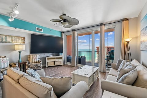 Spacious living room on the 23rd floor with sleeper sofa and access to the balcony.