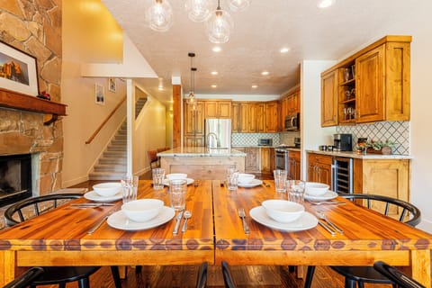 Dining area with seating for seven and kitchen island seating for three