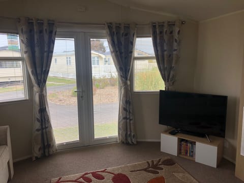 Double patio doors, large open living room.