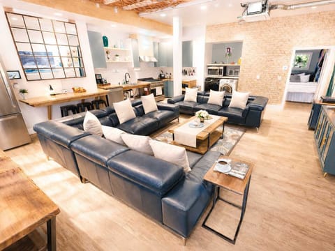 Open-Concept Living Room Featuring 4 Sofa Beds, Expansive Seating, and a Comfortable Resort-Style Layout — Ideal for Lounging, Social Time, and Extra Sleeping Space
