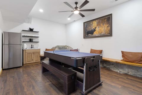 There is a full sized refrigerator and sink, along with bar equipment so you can enjoy the game room.