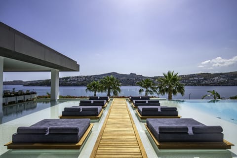 Indoor pool, seasonal outdoor pool, pool umbrellas, sun loungers