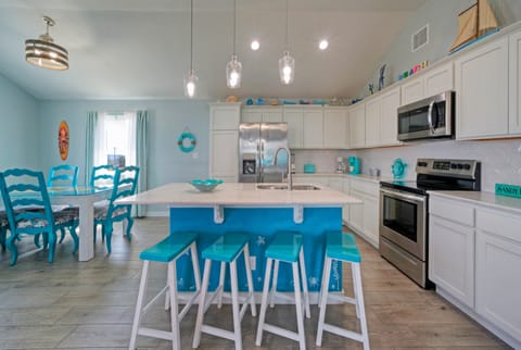 Step inside to a charming interior filled with colorful decor. (Sandy Feet Retreat)