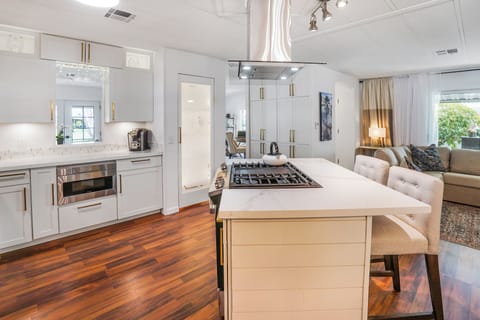 Elegant kitchen island with bar seating overlooking living area