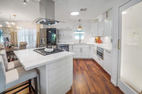 Chef's kitchen with quartz island, gas cooktop, and premium finishes