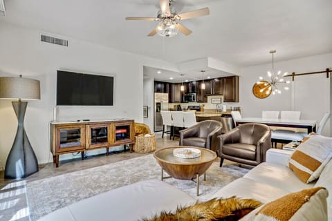 Relax on the soft gray sectional sofa, perfect for lounging or watching TV.